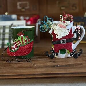 2 Christmas ornaments that are glittery and Santa’s head bobbles